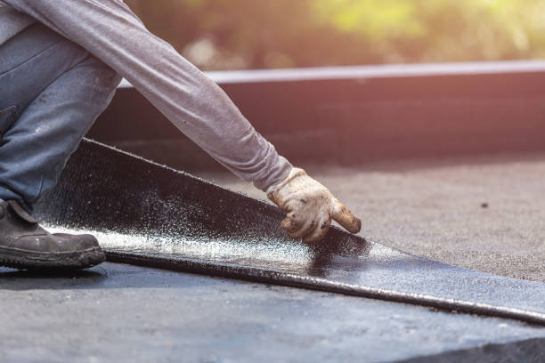 Professional Waterproofing technician working in Norman, IN